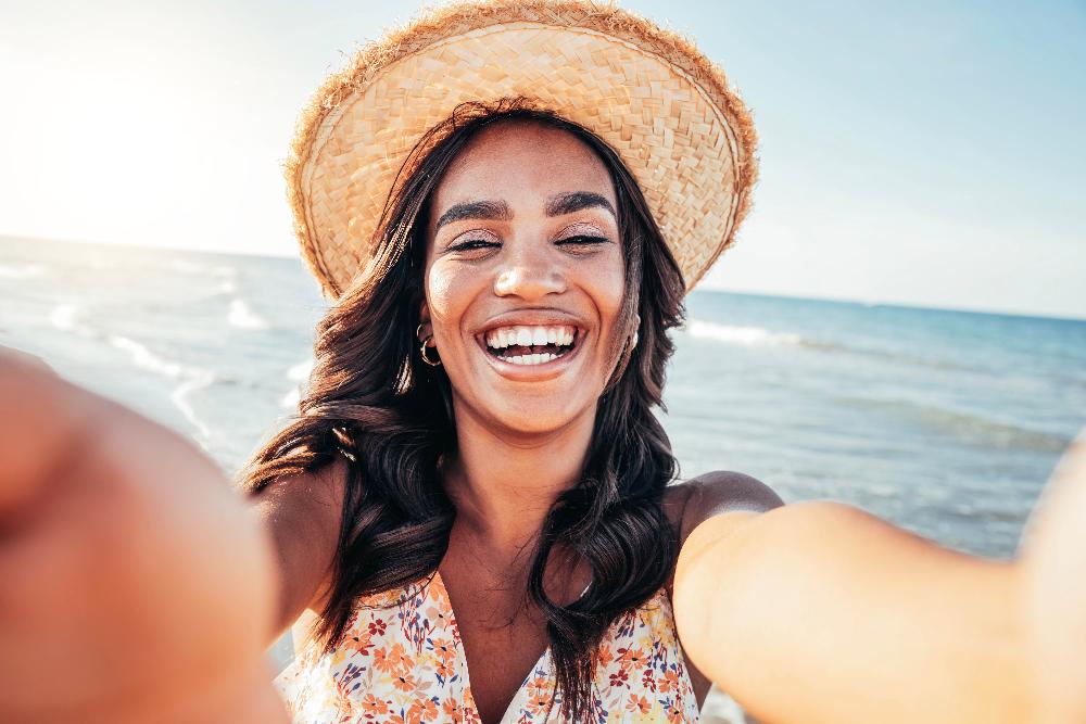 beautiful-black-woman-taking-selfie-beach